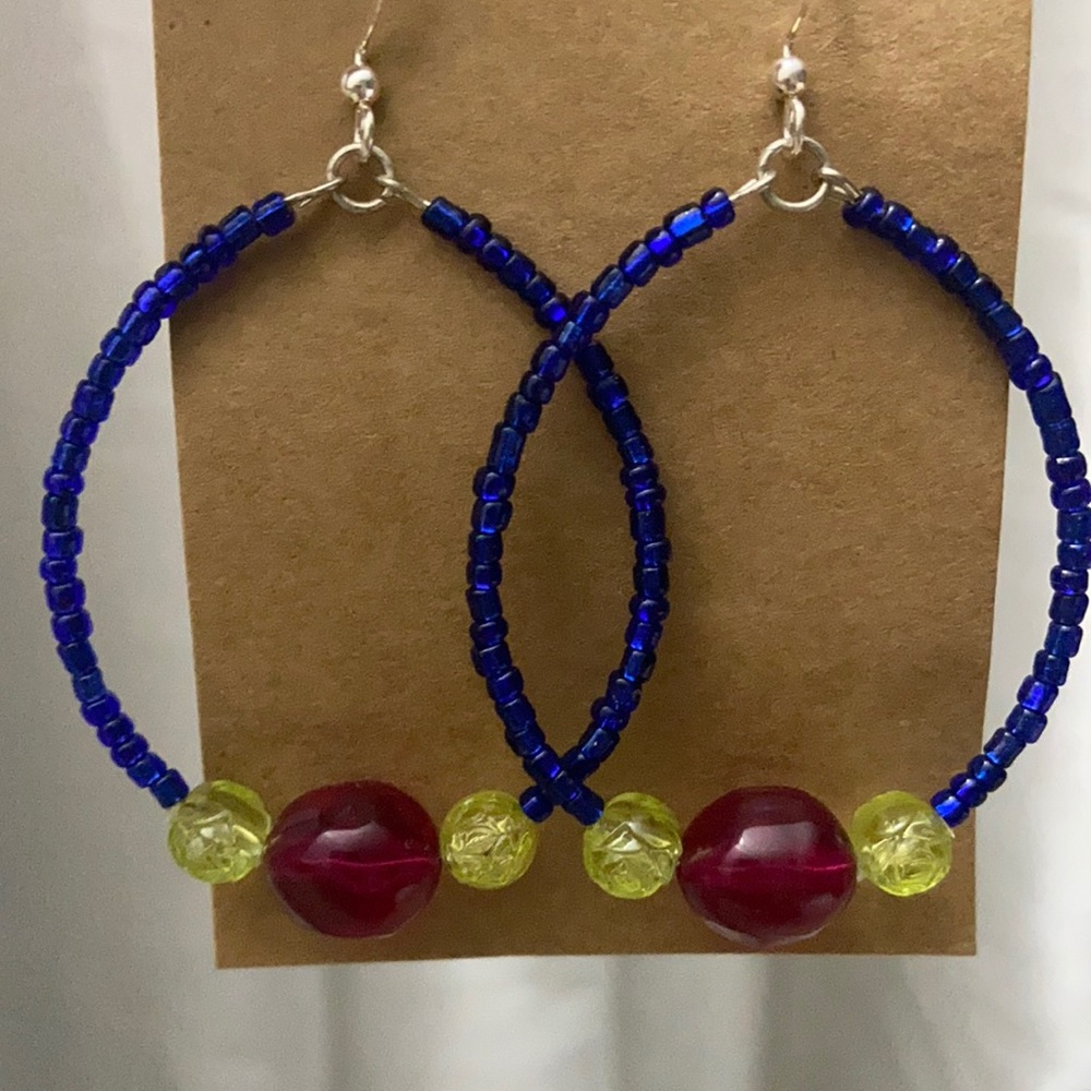 Round earrings in royal blue, yellow and wine colors.